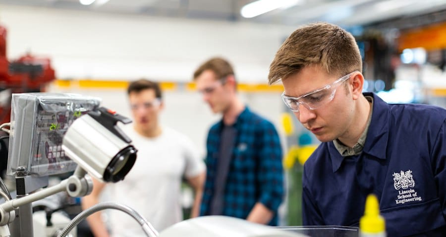 Technicians working together on equipment